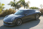 Porsche 991 Carrera Euro GT chin spoiler front bumper splitter in polyurethane, black, installed on a 2012–2015 model.