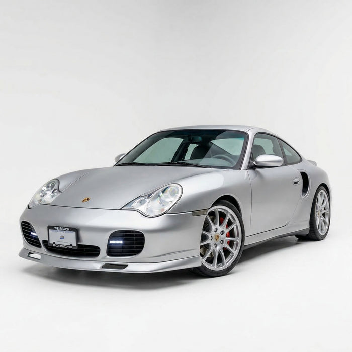 Porsche 996 Turbo front lip spoiler in polyurethane by BetterBodies Motorsport, designed for 1999–2004 models, shown in close-up.