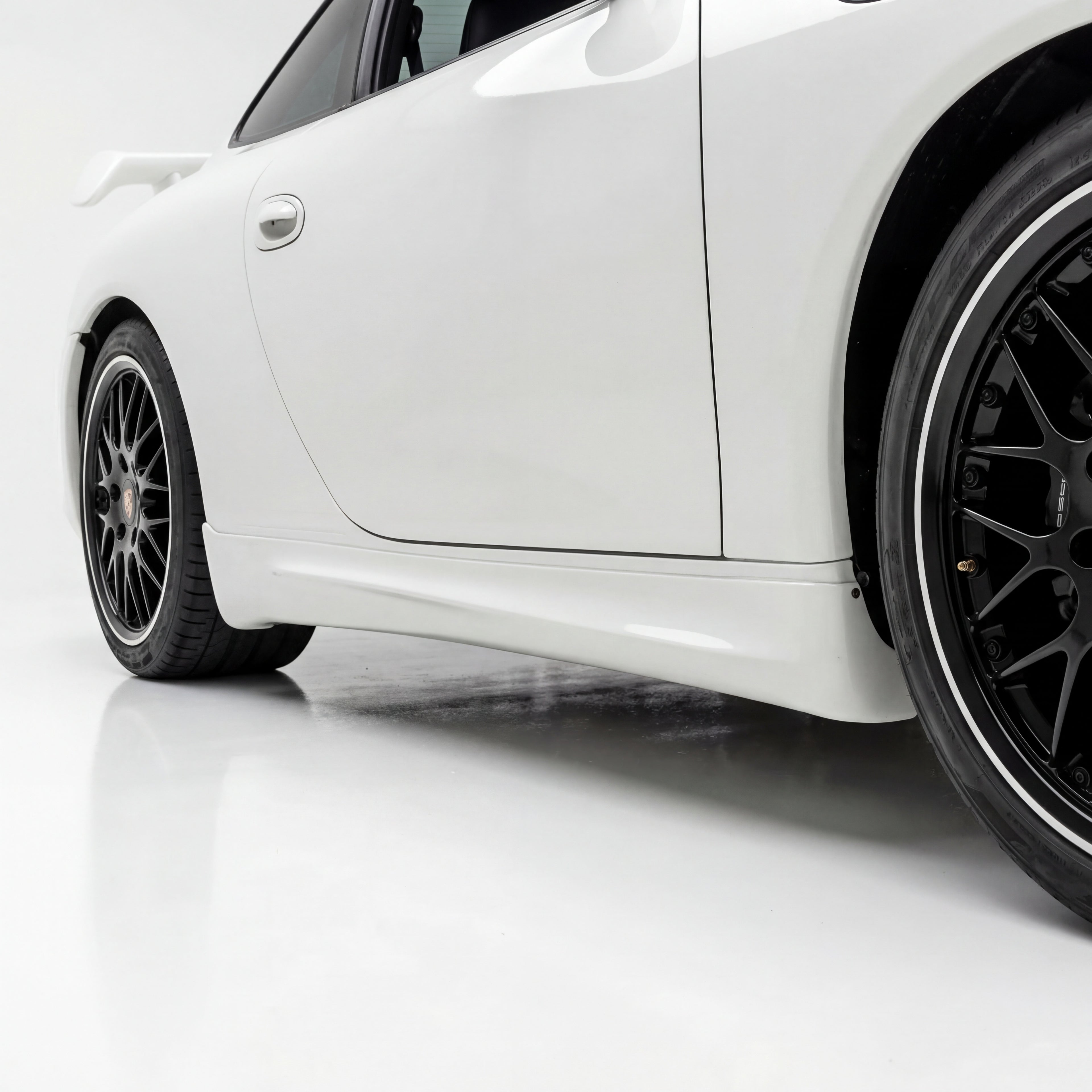 BetterBodies Motorsport Porsche 991 Carrera 2012-2015 side rocker panels, aerodynamic side skirts for body kit upgrade.