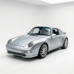 Porsche 993 RS style front splitters in polyurethane for 1995-1998, installed on a sports car, enhancing aerodynamic performance.