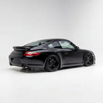Fiberglass Porsche 997 Carrera bolt-on ducktail spoiler by BetterBodies Motorsport, designed for 2005–2012 models.