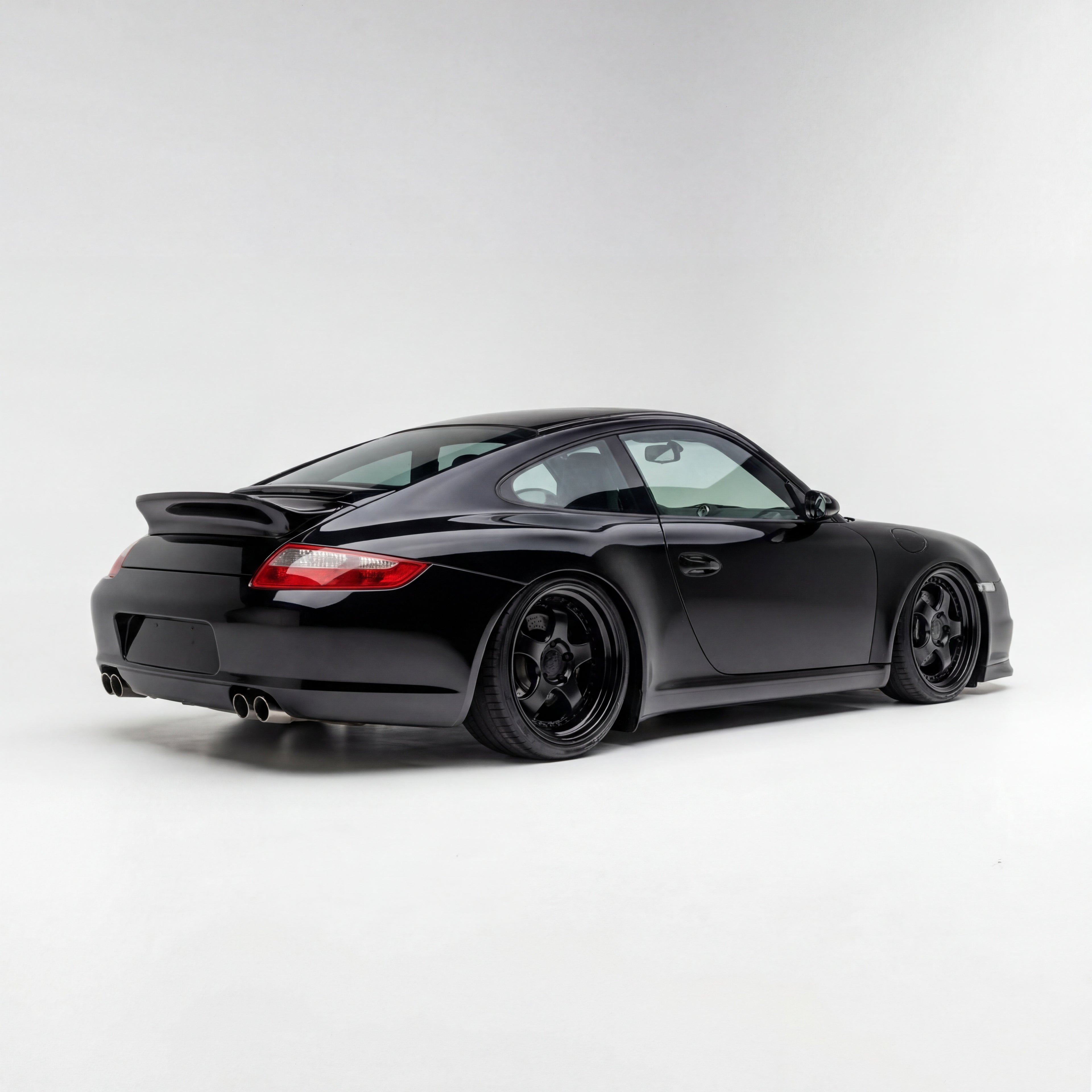 Fiberglass Porsche 997 Carrera bolt-on ducktail spoiler by BetterBodies Motorsport, designed for 2005–2012 models.