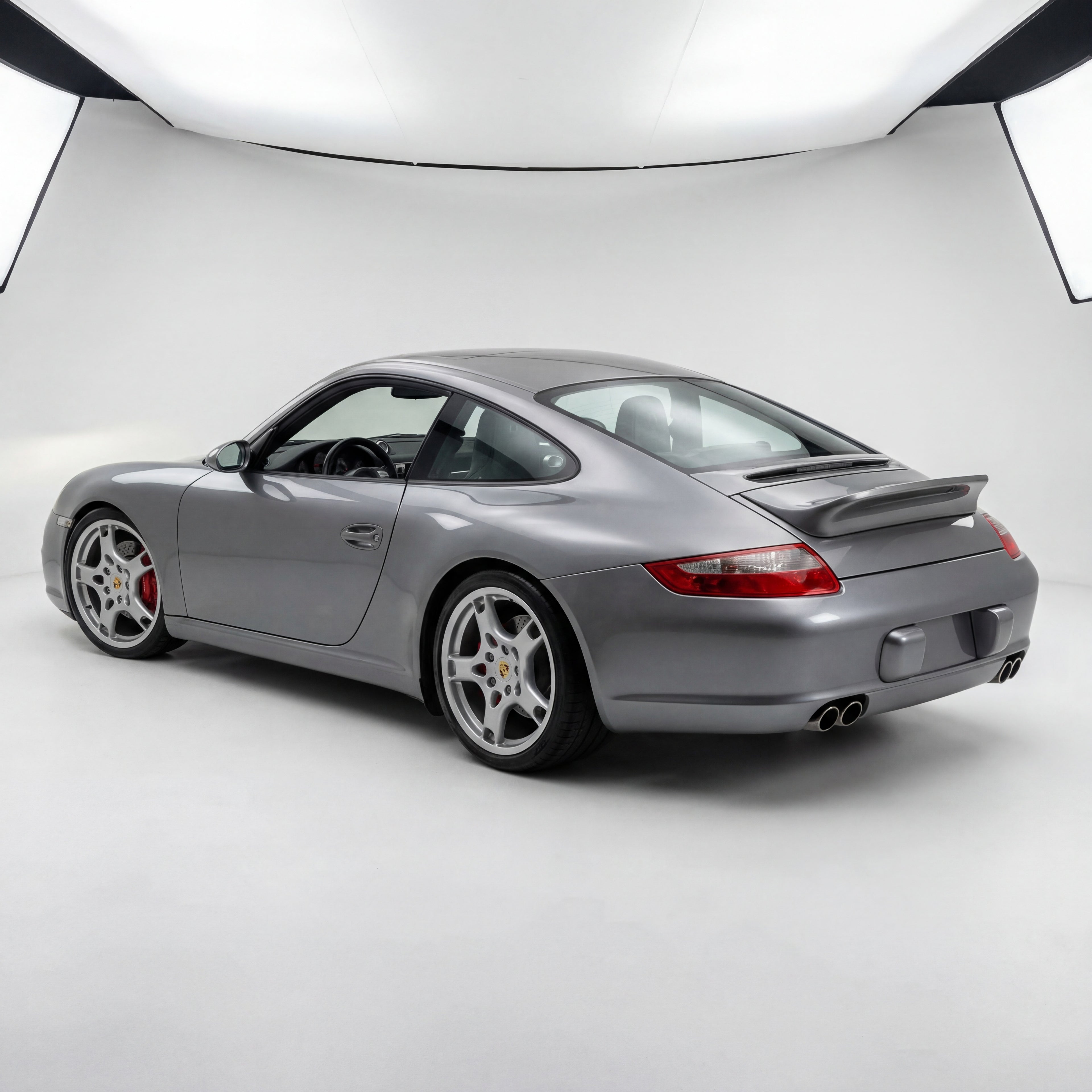 Fiberglass Porsche 997 Carrera wing with bolt-on ducktail spoiler, racing upgrade, installed on a 2005–2012 model, by BetterBodies Motorsport.