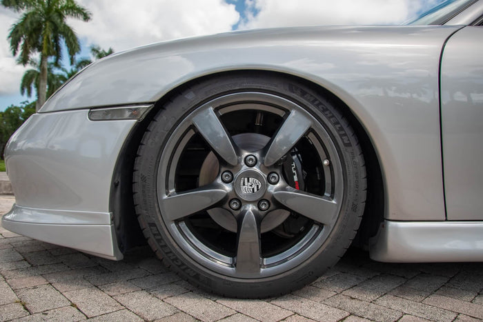 Silver polyurethane Porsche Boxster Spyder style side rockers by BetterBodies Motorsport on a 1997–2004 Boxster side skirt.