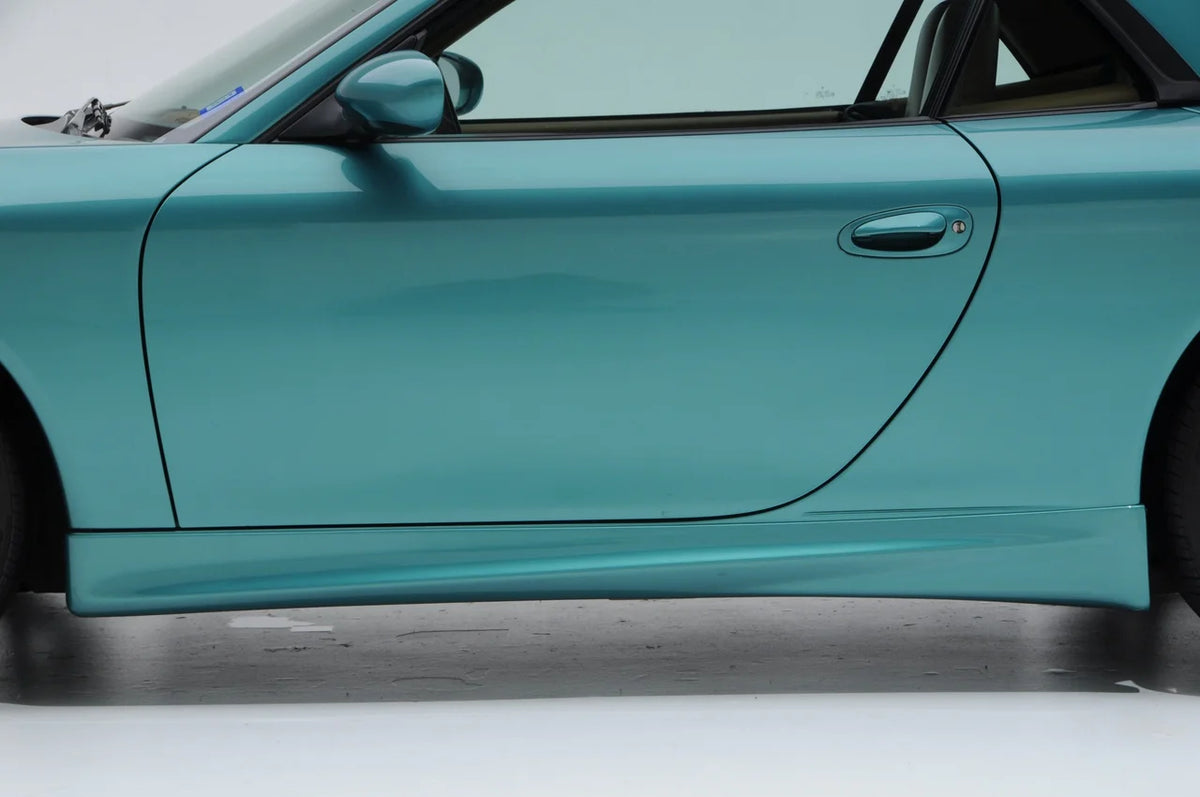 BetterBodies Motorsport Porsche 996 Carrera GT3-style side skirts for 1999-2004 996 Carrera model, showing sleek rocker panel design.