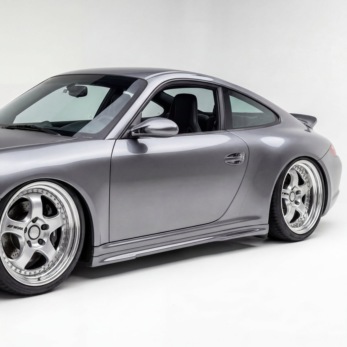 Silver Porsche 997 Carrera Mach II side skirts by BetterBodies Motorsport for narrow body 2005–2012 model