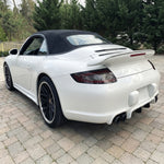 White Porsche 997.1 rear bumper diffuser in RUF TA-style polyurethane by BetterBodies Motorsport for 2005–2008 models.