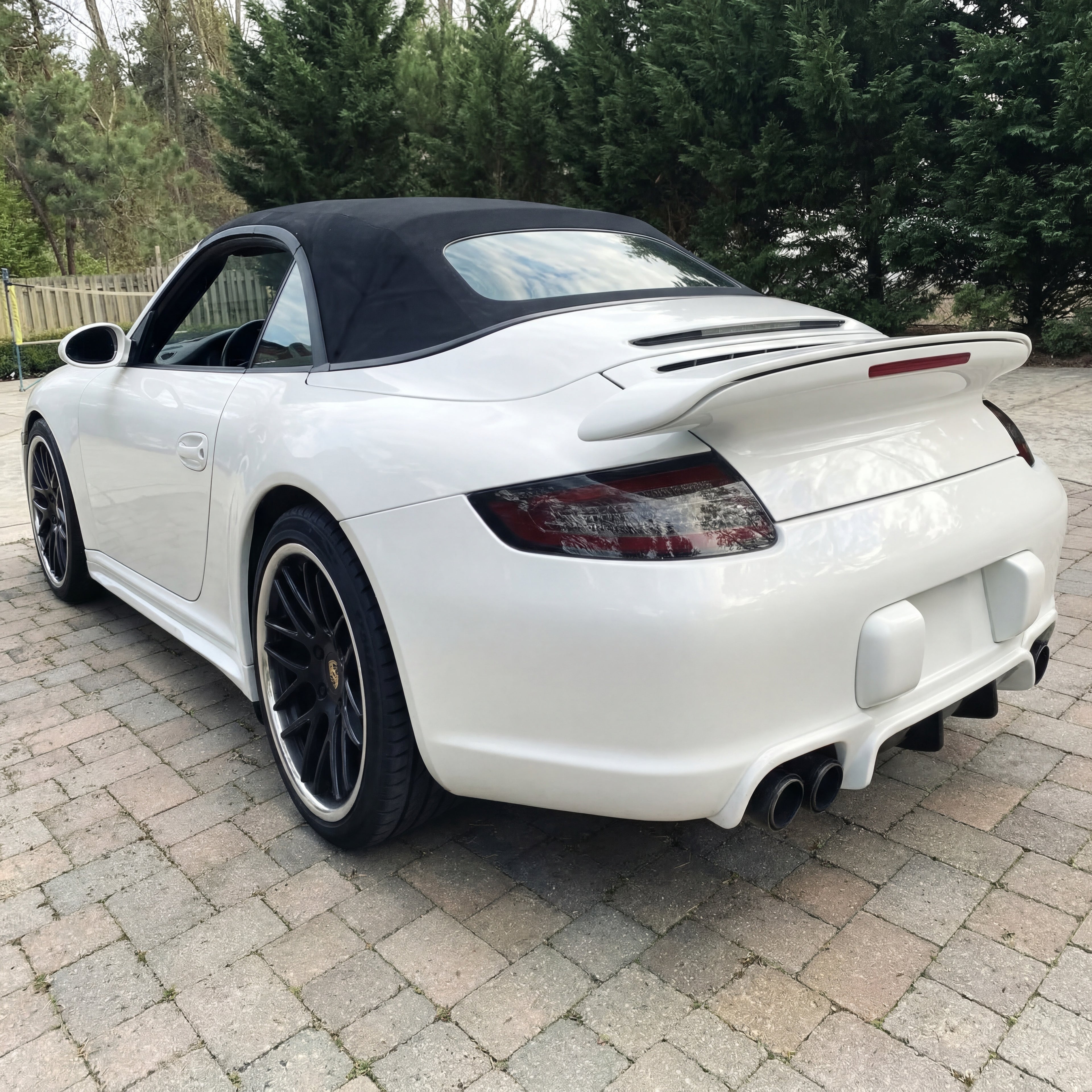 White Porsche 997.1 rear bumper diffuser in RUF TA-style polyurethane by BetterBodies Motorsport for 2005–2008 models.