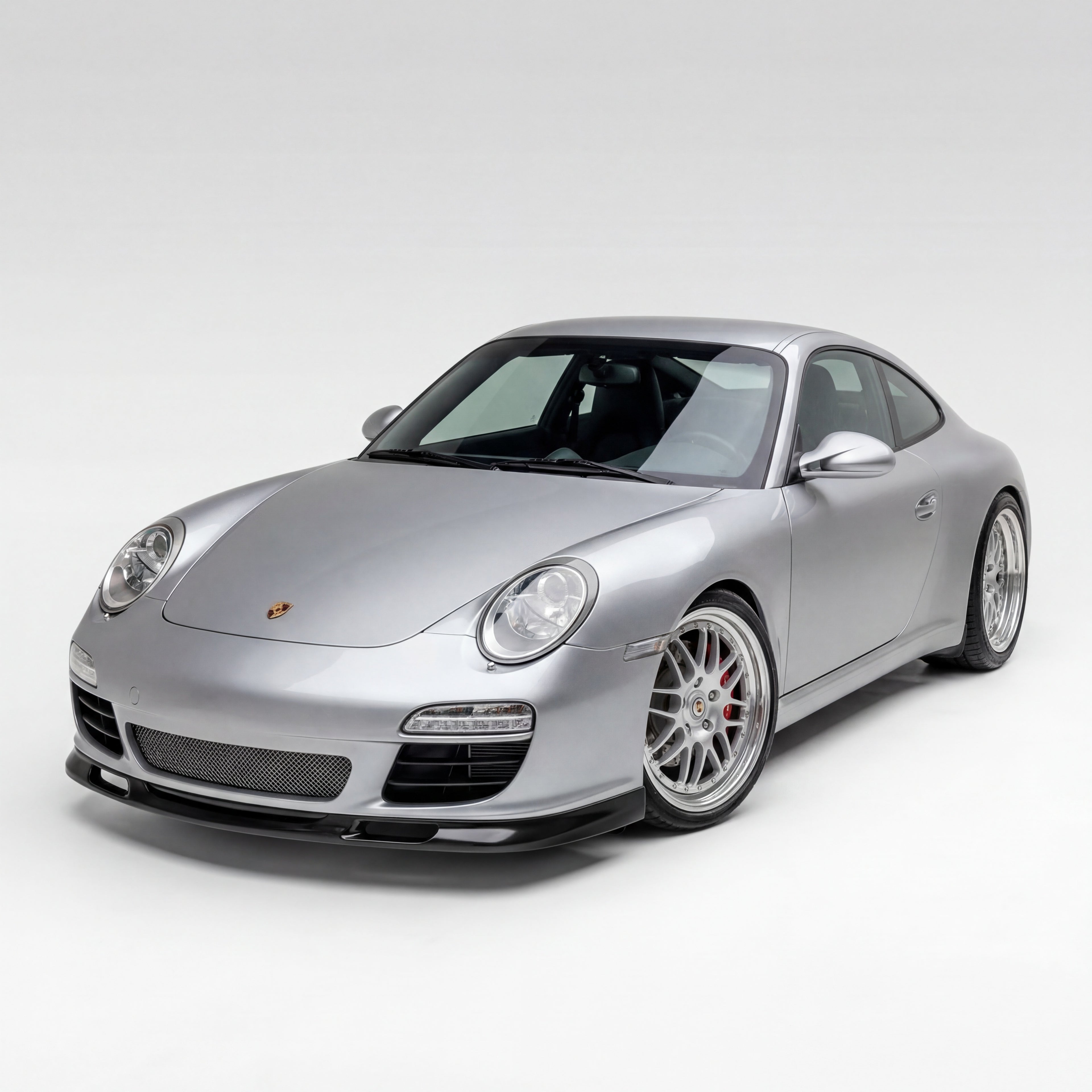 Porsche 997.2 GT3-style front lip spoiler in polyurethane, shown on a 2009–2012 model, designed for enhanced aerodynamics.