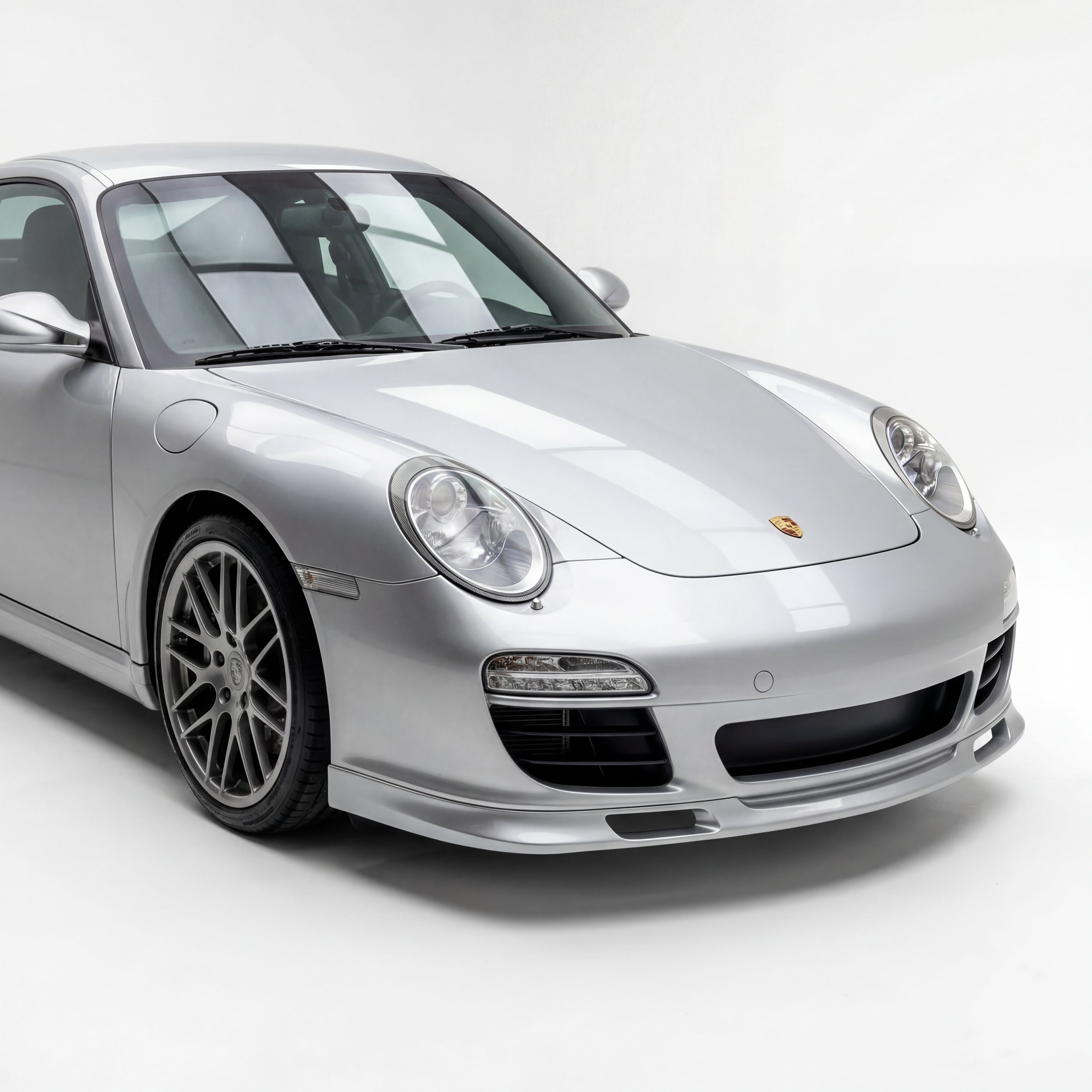 Porsche 997.2 GT3-style polyurethane front lip spoiler, installed on the front of a 2009–2012 model 911.