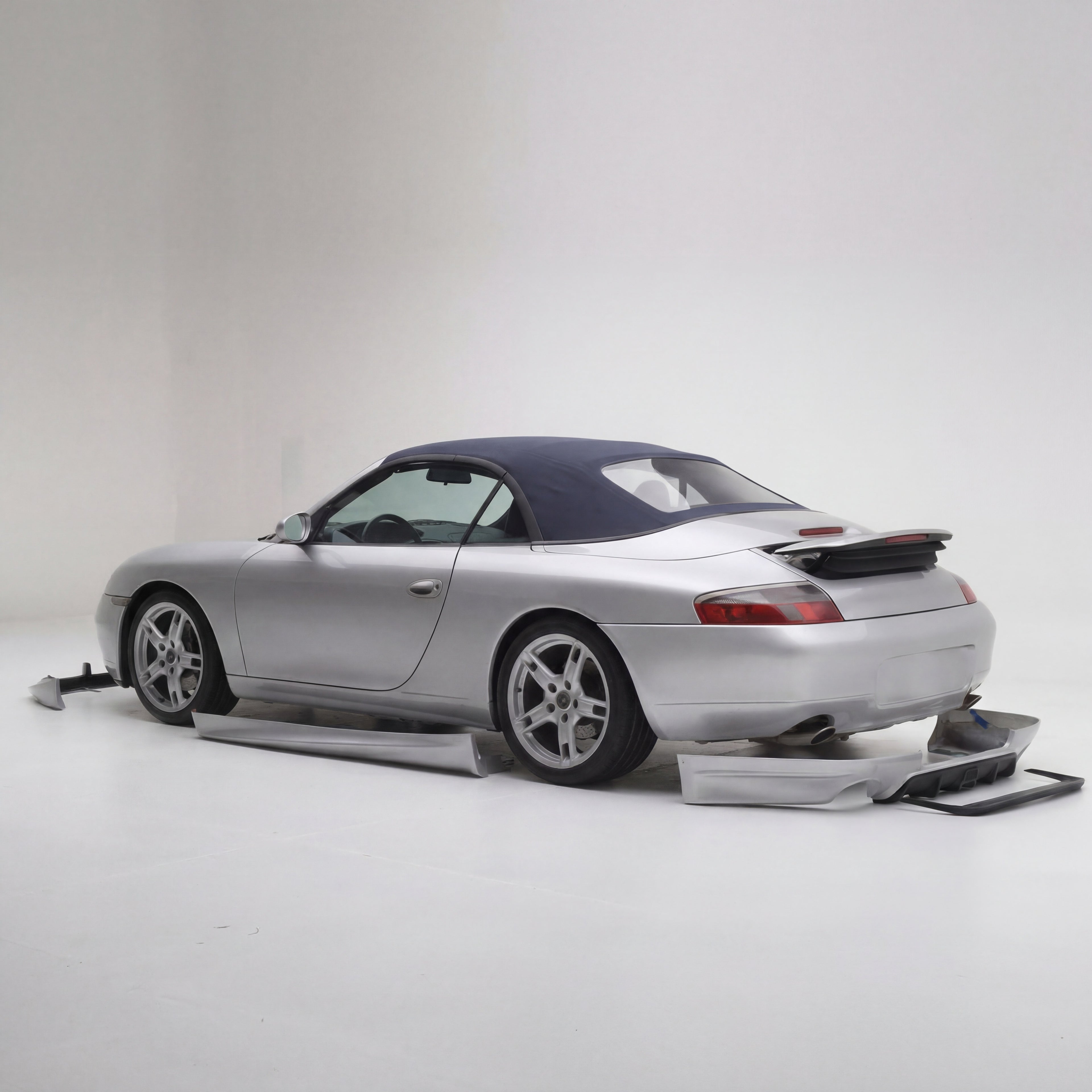 BetterBodies Motorsport Porsche 996.1 Carrera rear bumper diffuser in racing style for 1999–2001 model, designed for improved aerodynamics.