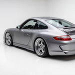 Polyurethane side skirts for Porsche 997 Carrera Mach II narrow body, 2005–2012, by BetterBodies Motorsport, shown on vehicle.