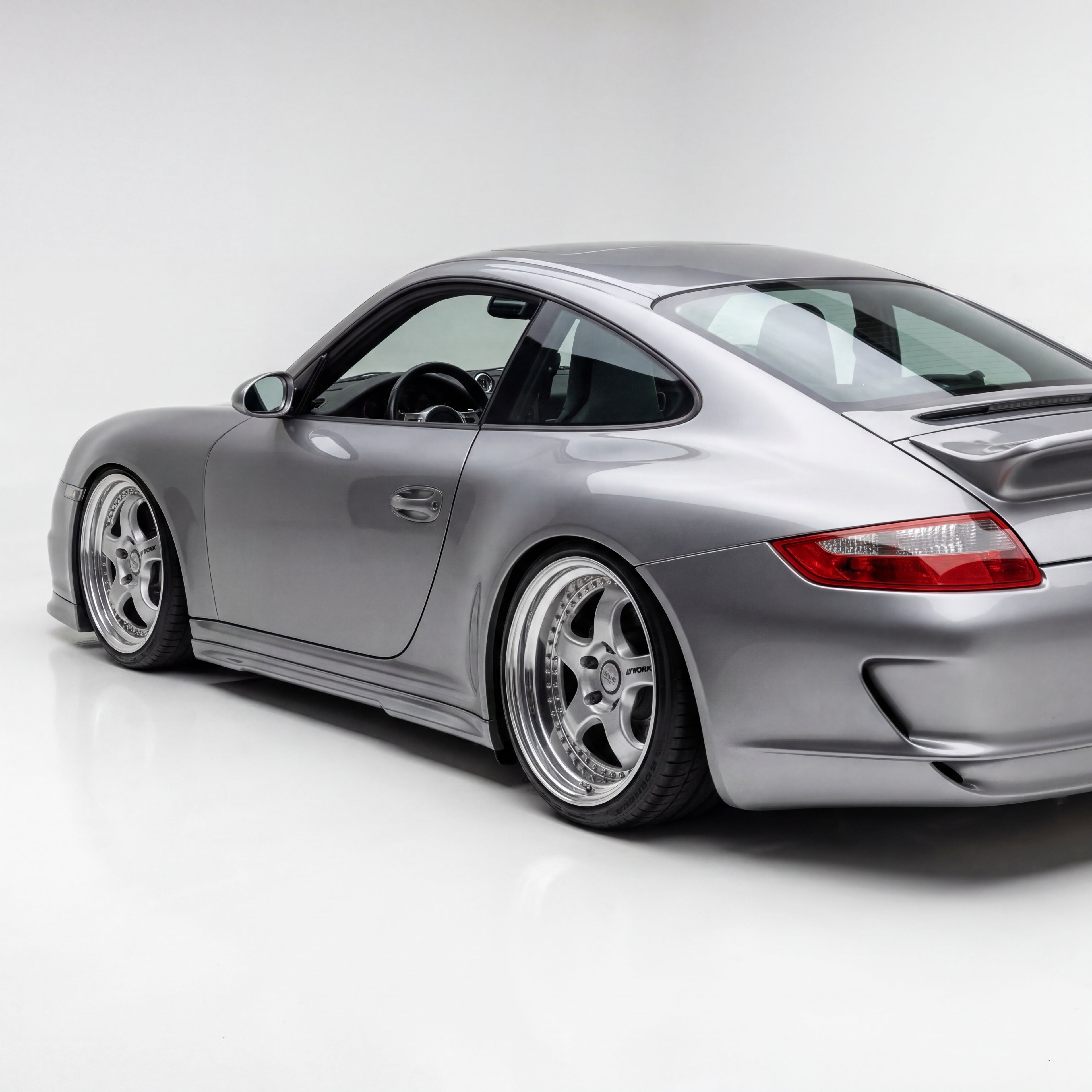 Polyurethane side skirts for Porsche 997 Carrera Mach II narrow body, 2005–2012, by BetterBodies Motorsport, shown on vehicle.