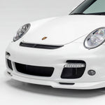 Polyurethane widebody front bumper lip for Porsche 997 Turbo (2007–2009) by BetterBodies Motorsport, shown on a sleek car.